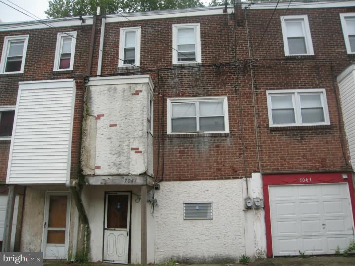 7041 Clinton Road Upper Darby, PA 19082 - Photo 6 of 6 a front view of a house with a door