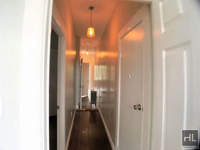 a view of a bathroom from a hallway