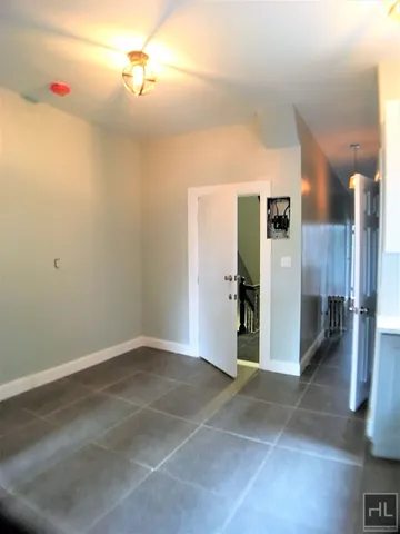a view of a hallway with a refrigerator