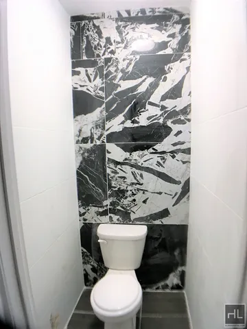 a bathroom with a toilet and a sink