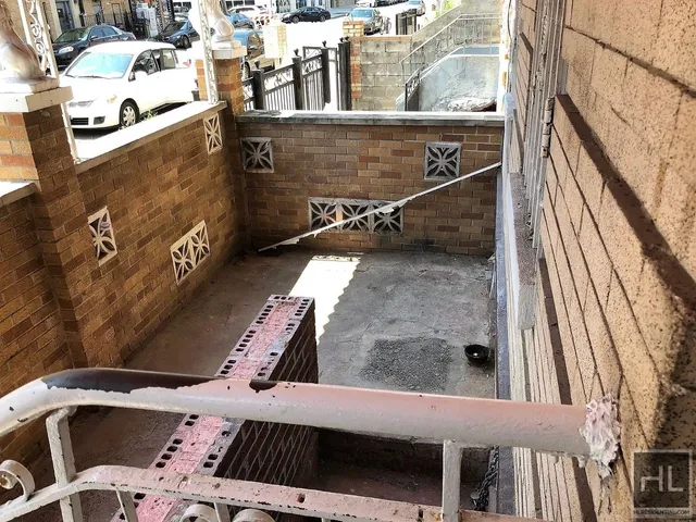 a view of balcony with furniture