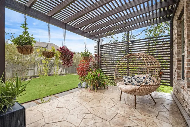 a potted plant sitting in front of a house