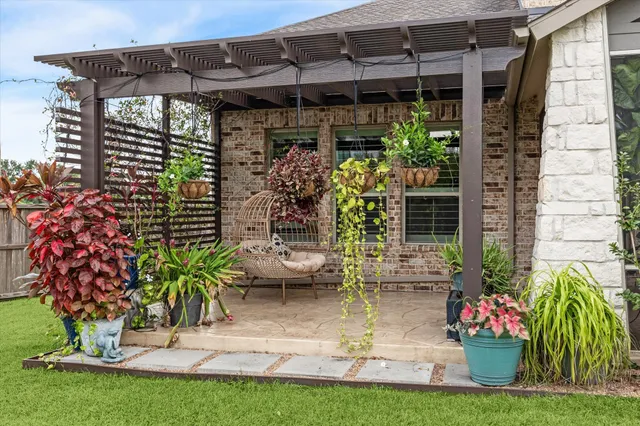 a view of a porch with potted plants