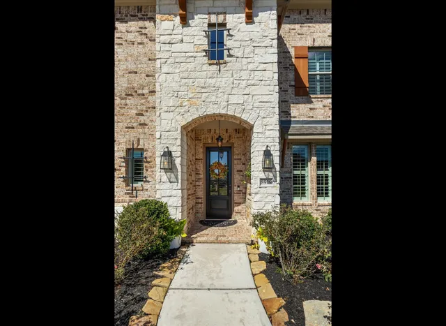 a front view of a house with yard
