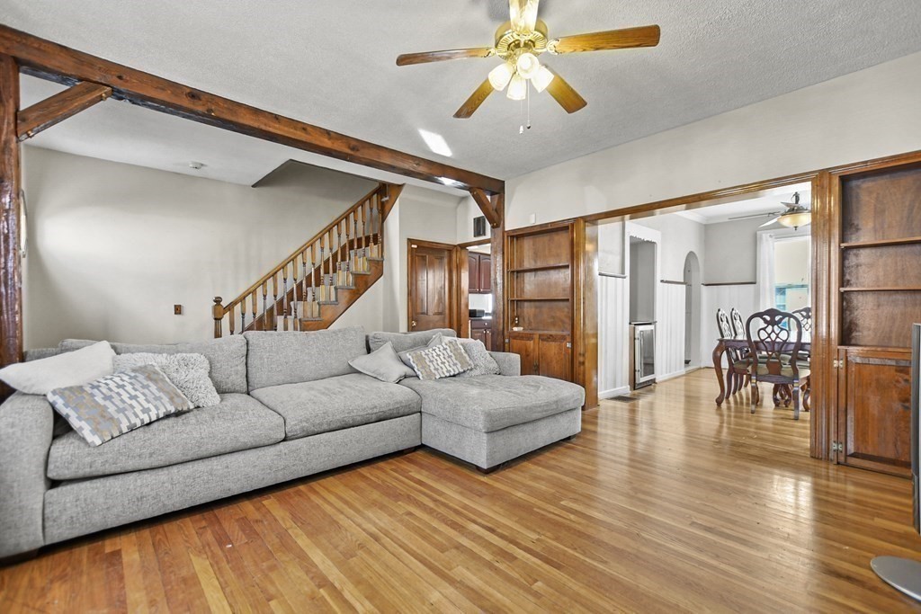 242 Eastern Avenue Lynn, MA 01902 - Photo 13 of 23 a living room with furniture and a wooden floor