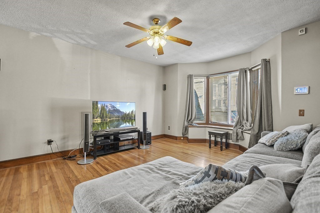 242 Eastern Avenue Lynn, MA 01902 - Photo 14 of 23 a living room with furniture and a flat screen tv