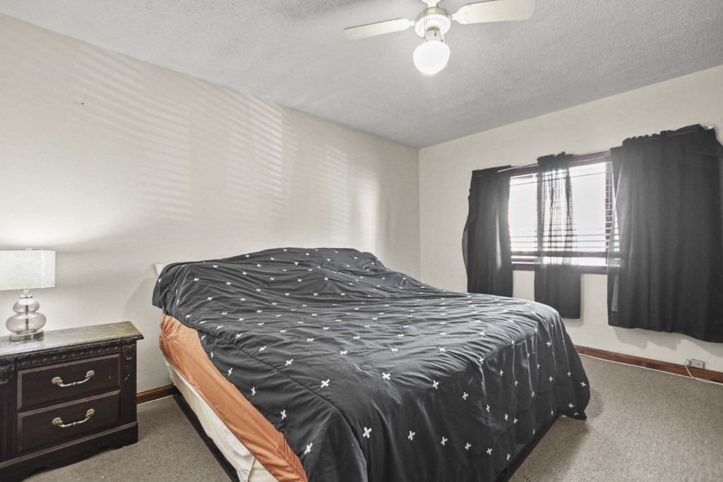 242 Eastern Avenue Lynn, MA 01902 - Photo 16 of 23 a bedroom with a bed and window