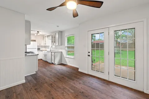 a view of kitchen with wooden floor and window