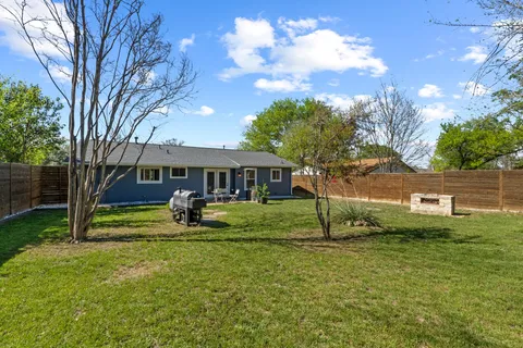 a house view with a sitting space and garden