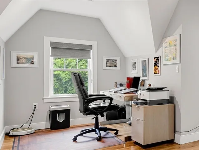 a view of walk in closet with clothes