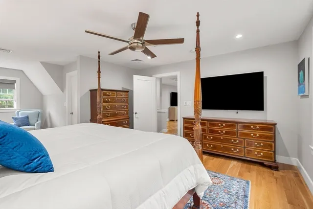 a bathroom with a granite countertop toilet sink and mirror