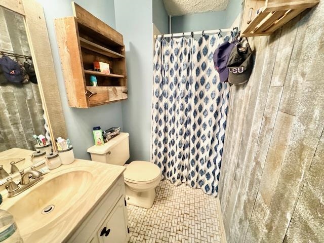 4636 Vincent Road Millington, TN 38053 - Photo 6 of 15 Bathroom featuring vanity, toilet, and curtained shower