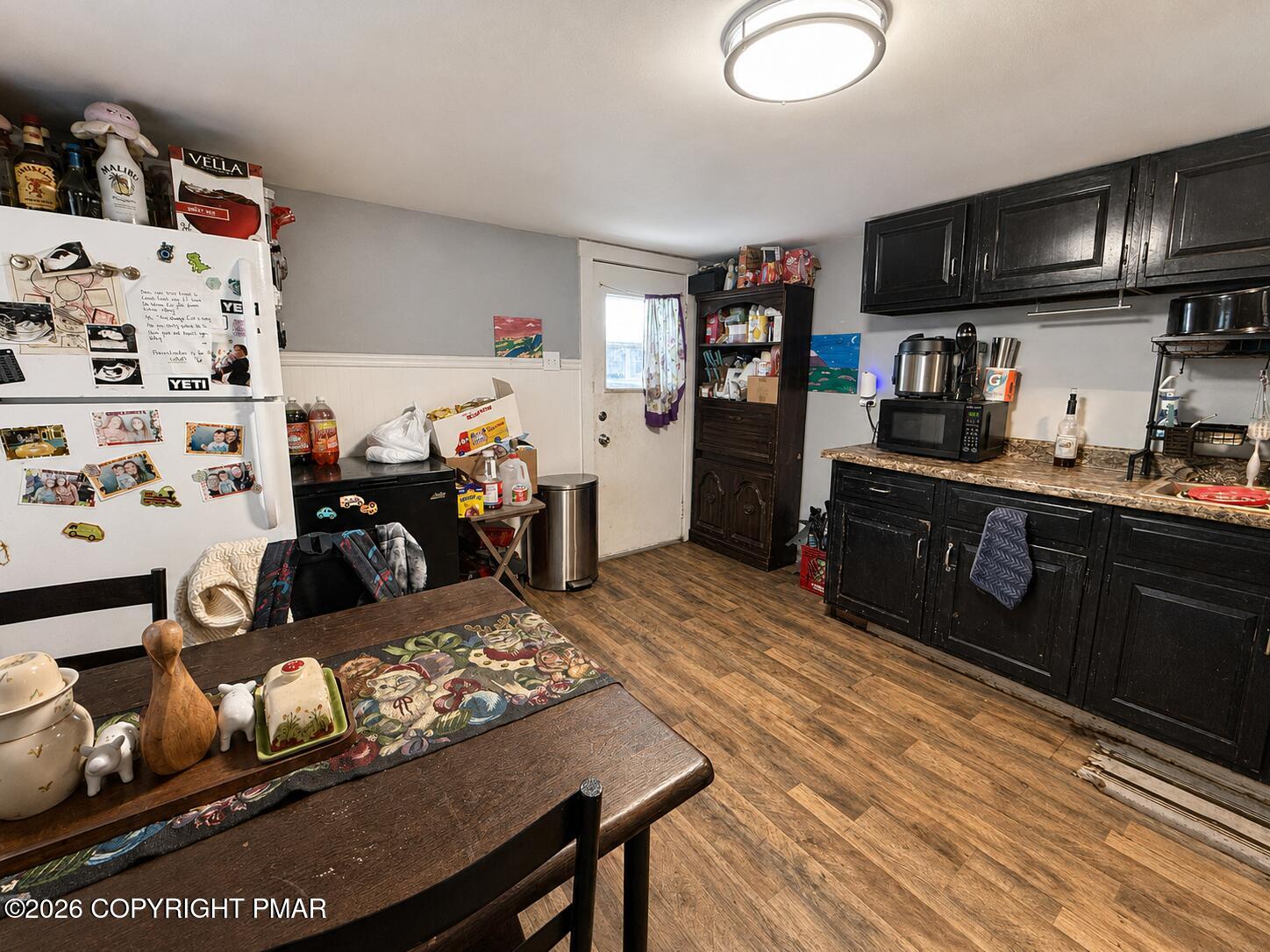 448 East Kline Avenue Lansford, PA 18232 - Photo 8 of 14 a kitchen with granite countertop lots of clutter and stainless steel appliances