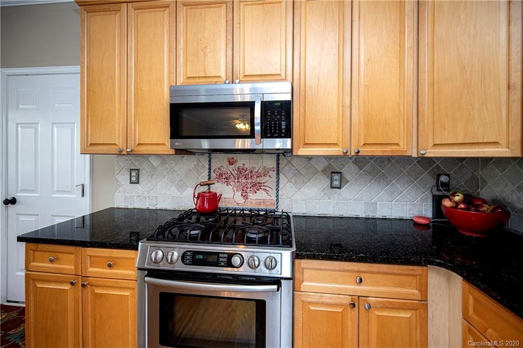 305 Brixham Place Fort Mill, SC 29708 - Photo 14 of 33 a kitchen with microwave a stove and a microwave