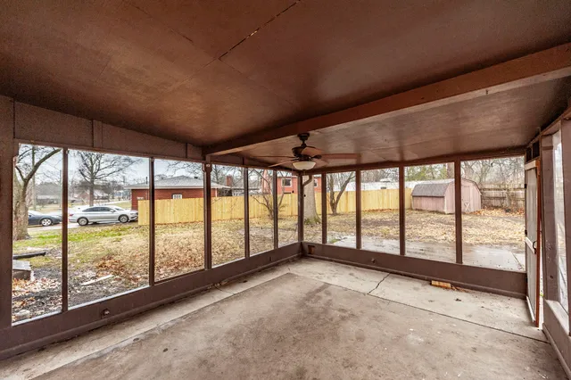 a view of an empty room with a large window