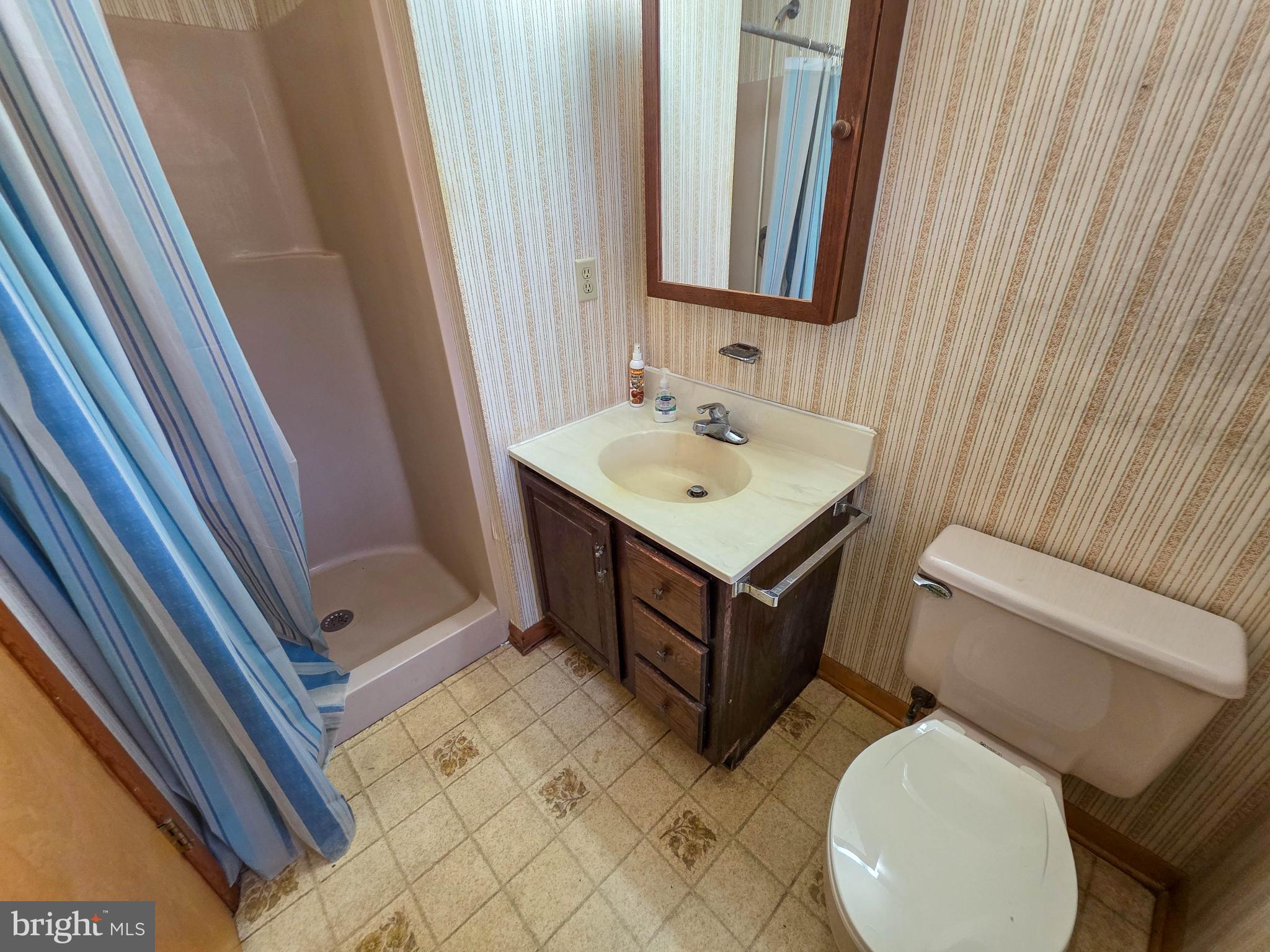 820 Storms Store Road Gettysburg, PA 17325 - Photo 22 of 39 a bathroom with a toilet a sink and a mirror
