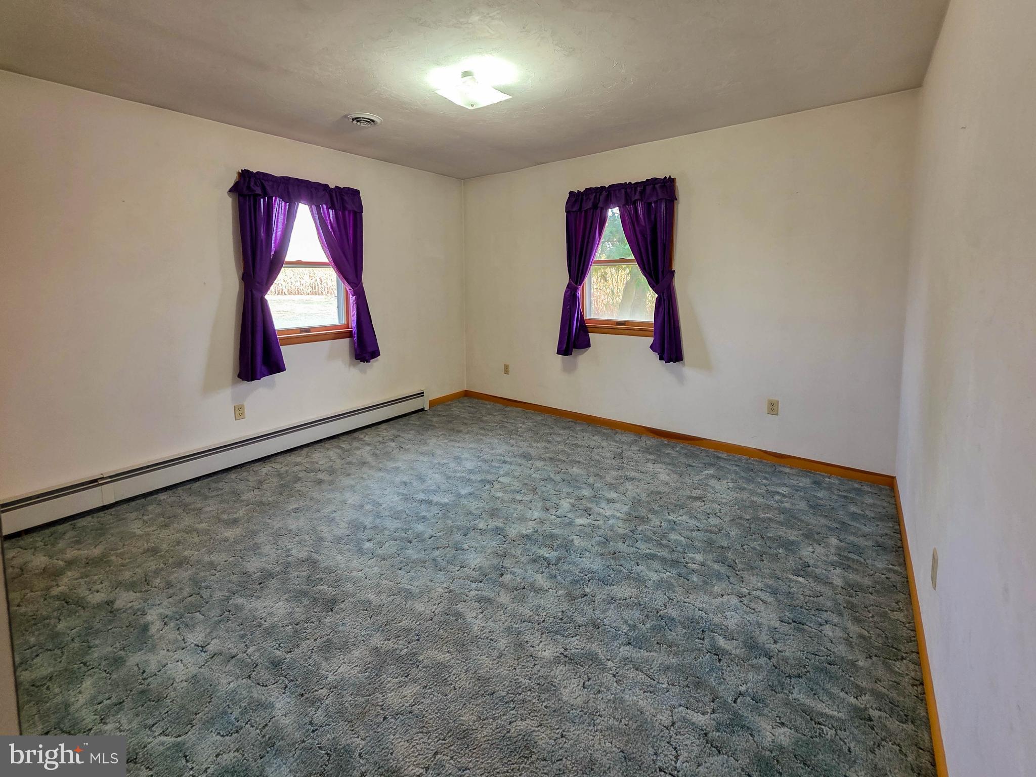 820 Storms Store Road Gettysburg, PA 17325 - Photo 8 of 39 an empty room with window and wall painting
