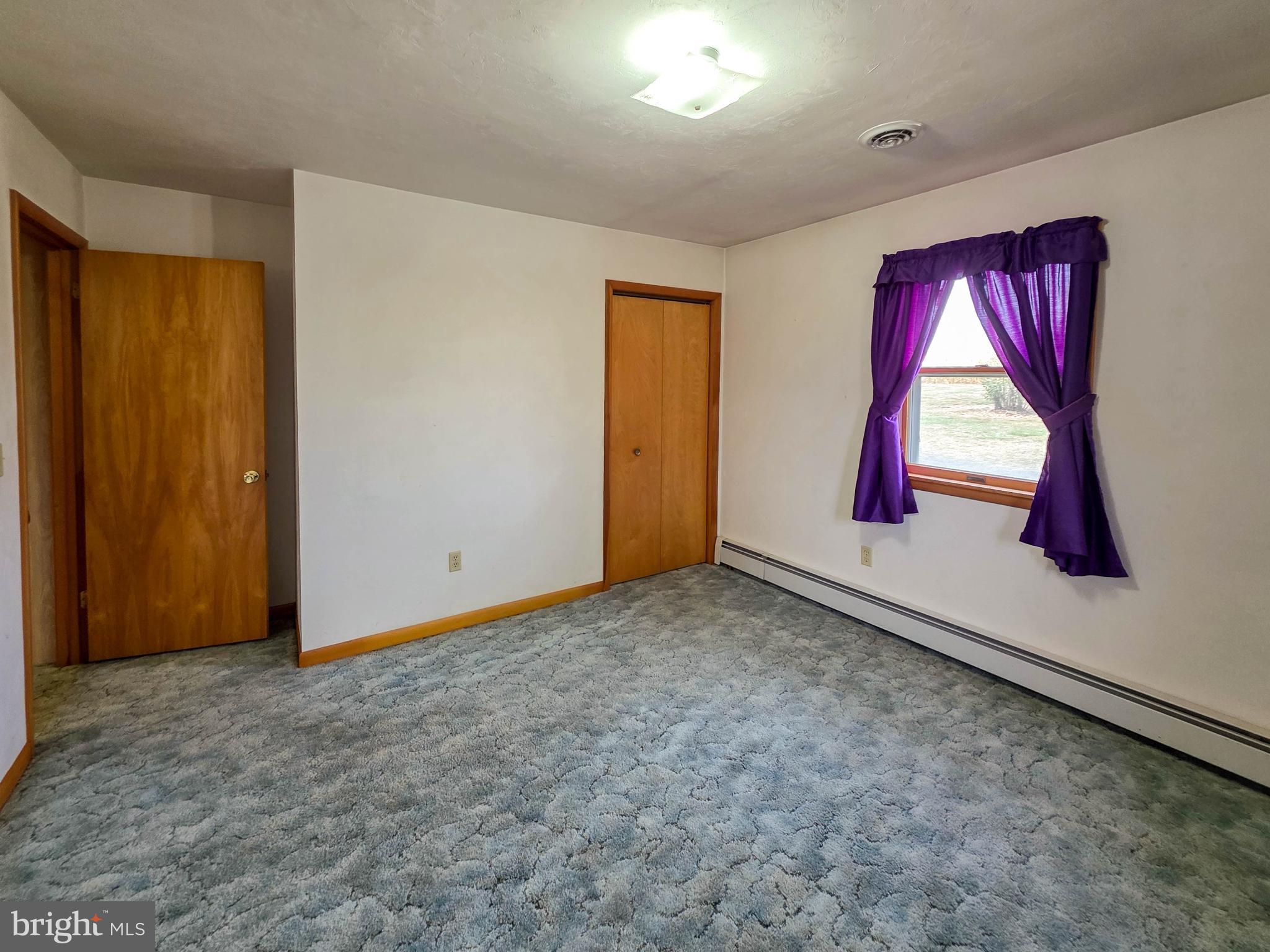 820 Storms Store Road Gettysburg, PA 17325 - Photo 9 of 39 an empty room with windows