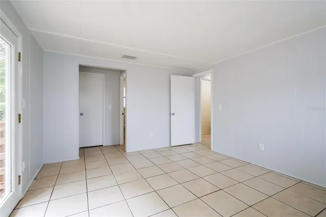 a view of an empty room and window