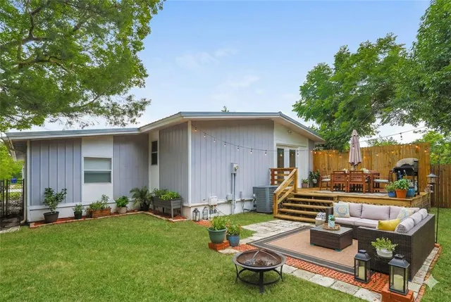 a backyard of a house with seating space
