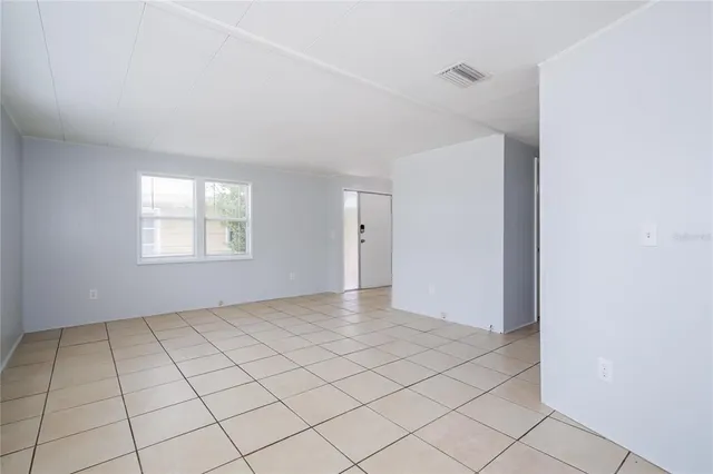 a view of an empty room and window