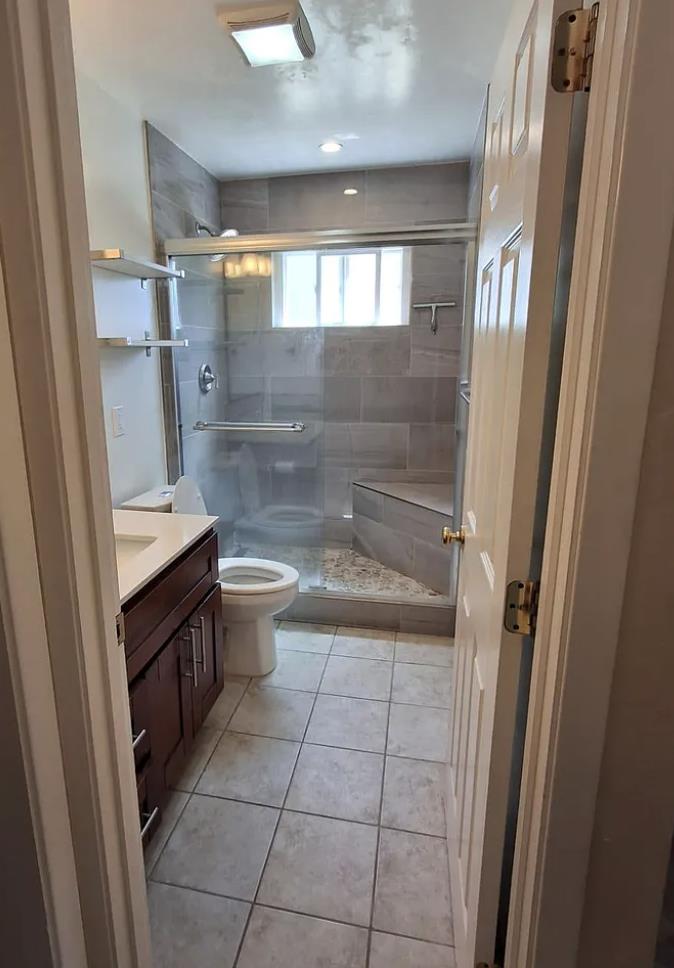 2273 Beckham Way Hayward, CA 94541 - Photo 9 of 11 a bathroom with a granite countertop sink toilet and shower