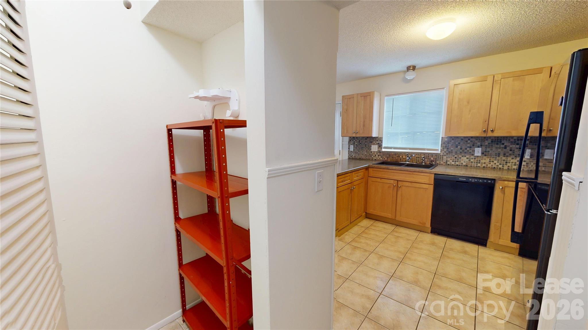 1211 Scaleybark Road Charlotte, NC 28209 - Photo 13 of 29 a kitchen with stainless steel appliances granite countertop a sink and cabinets