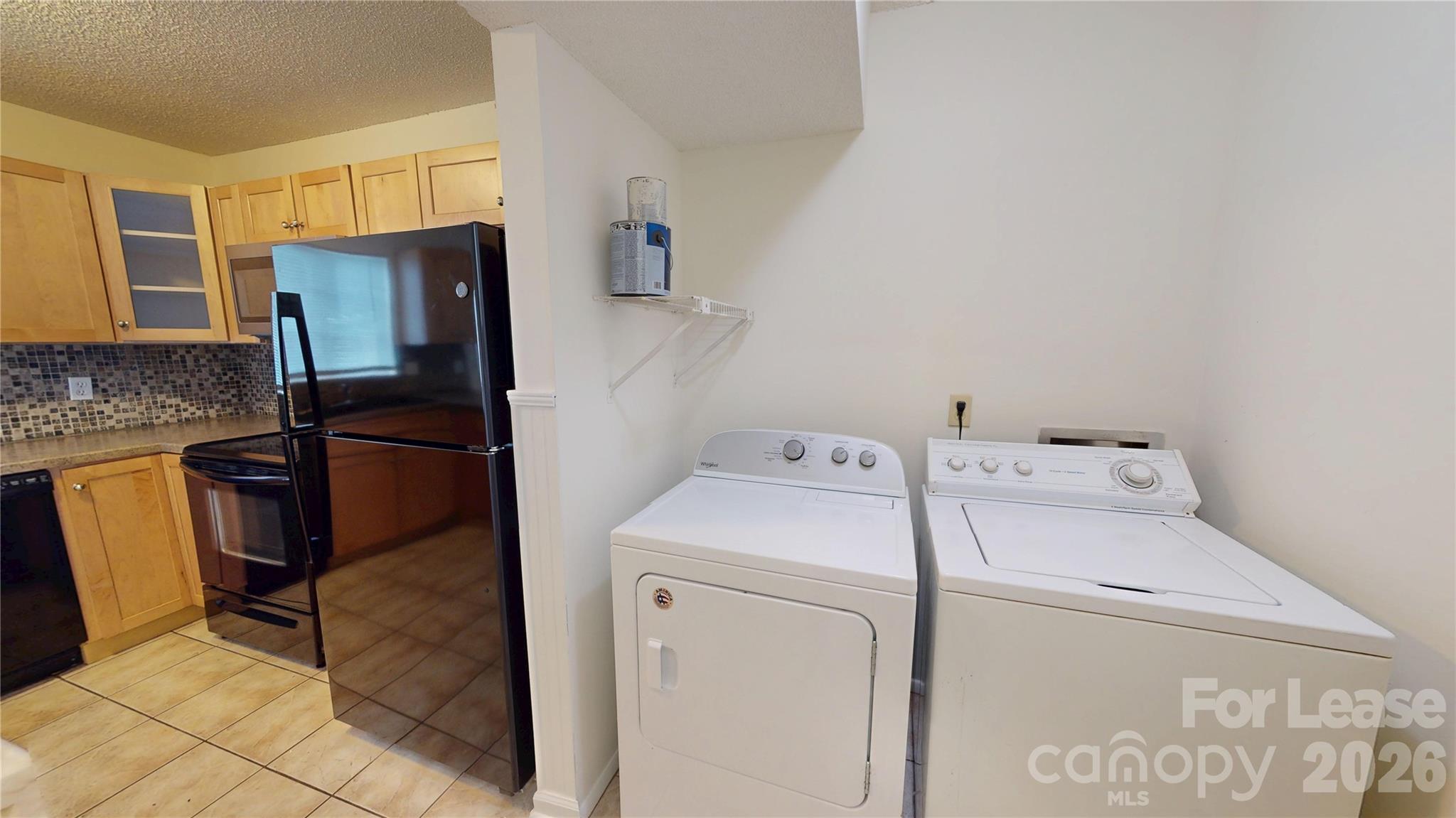 1211 Scaleybark Road Charlotte, NC 28209 - Photo 15 of 29 a utility room with dryer and washer