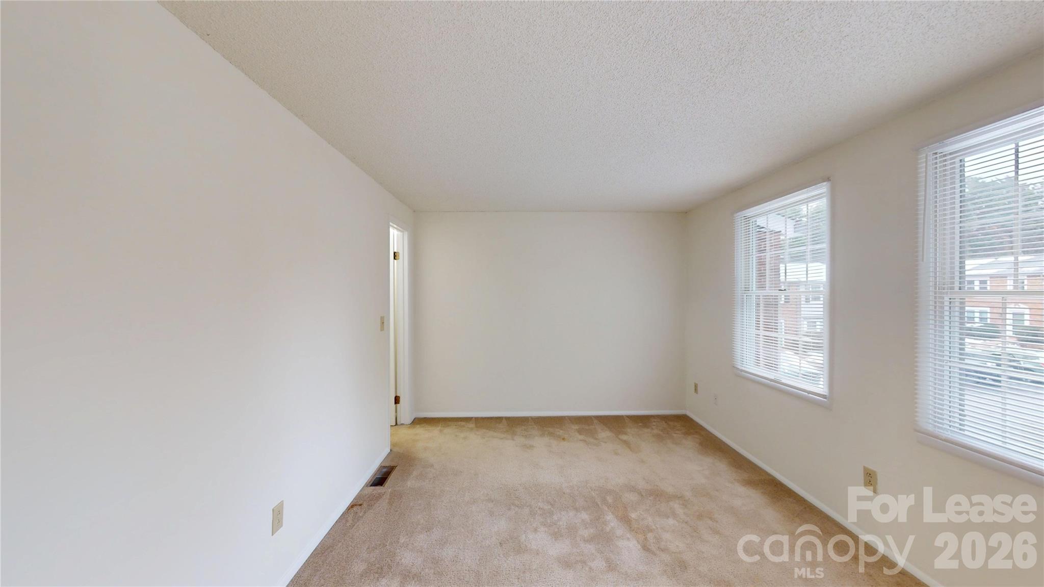 1211 Scaleybark Road Charlotte, NC 28209 - Photo 21 of 29 an empty room with windows