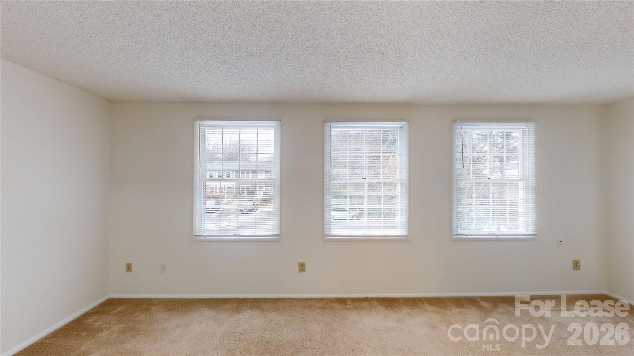 1211 Scaleybark Road Charlotte, NC 28209 - Photo 23 of 29 an empty room with windows