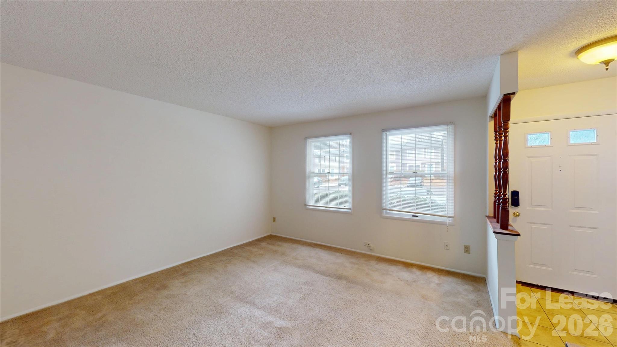 1211 Scaleybark Road Charlotte, NC 28209 - Photo 4 of 29 an empty room with windows