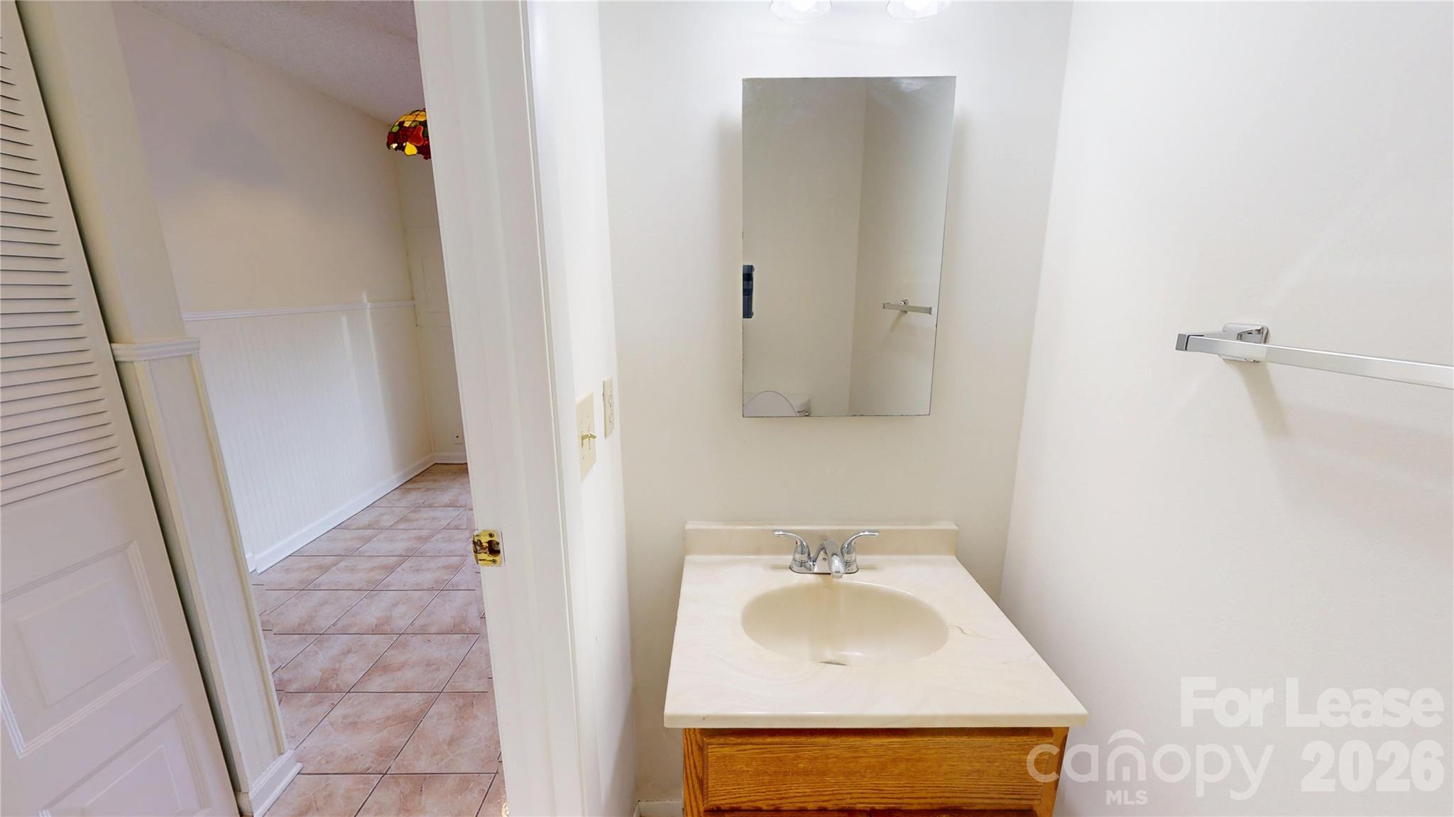 1211 Scaleybark Road Charlotte, NC 28209 - Photo 5 of 29 a bathroom with a sink a toilet and shower
