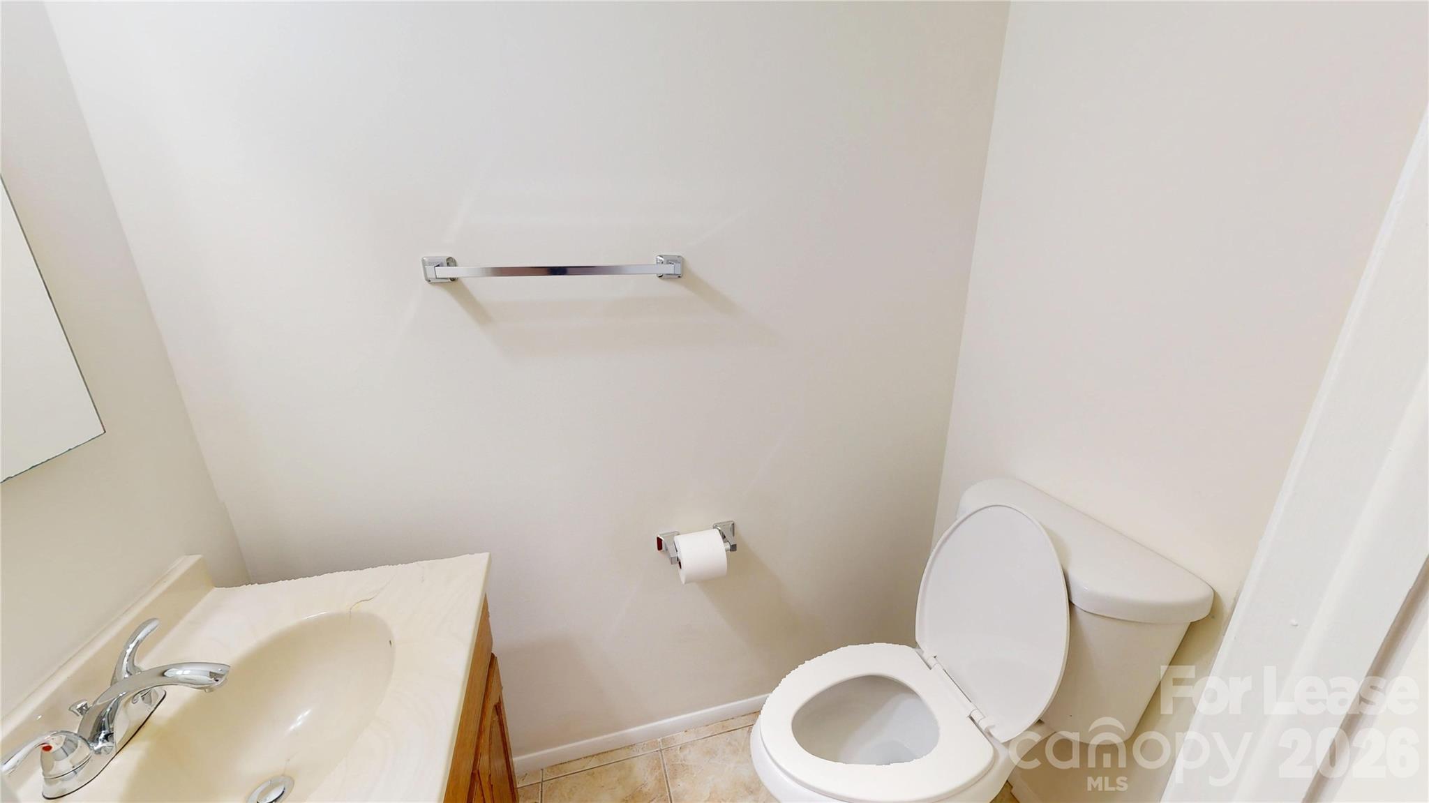 1211 Scaleybark Road Charlotte, NC 28209 - Photo 6 of 29 a bathroom with a toilet and a sink