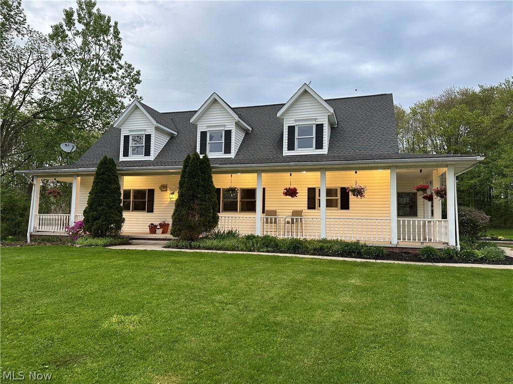 7609 Carter Road Northfield, OH 44067 - Photo 50 of 50 Twilight shot showing the recessed porch lighting