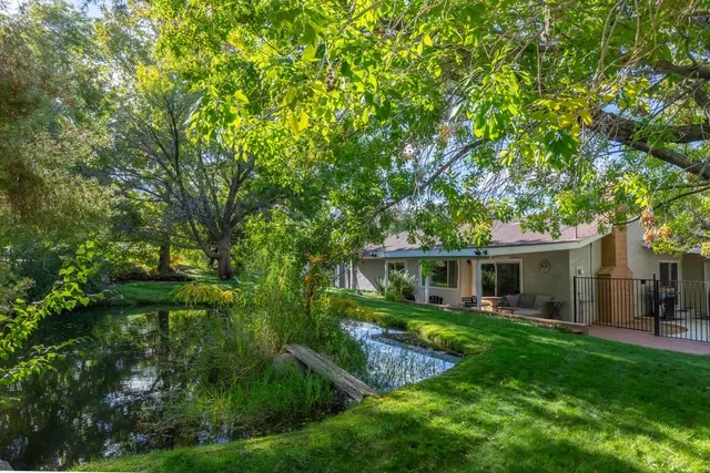 a view of house with a yard