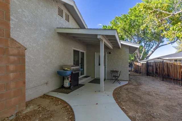 a backyard of a house with seating space