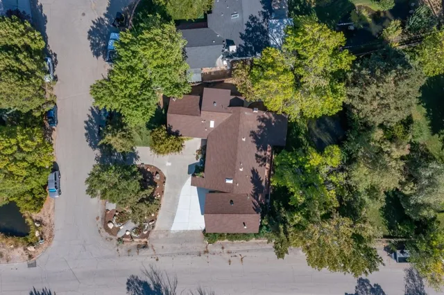 an aerial view of a house with a yard and a garden