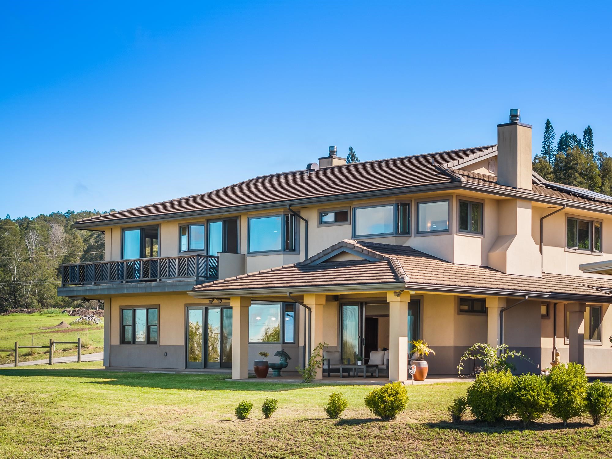 885 Pulehuiki Road Kula, HI 96790 - Photo 1 of 1 a front view of a building with a garden