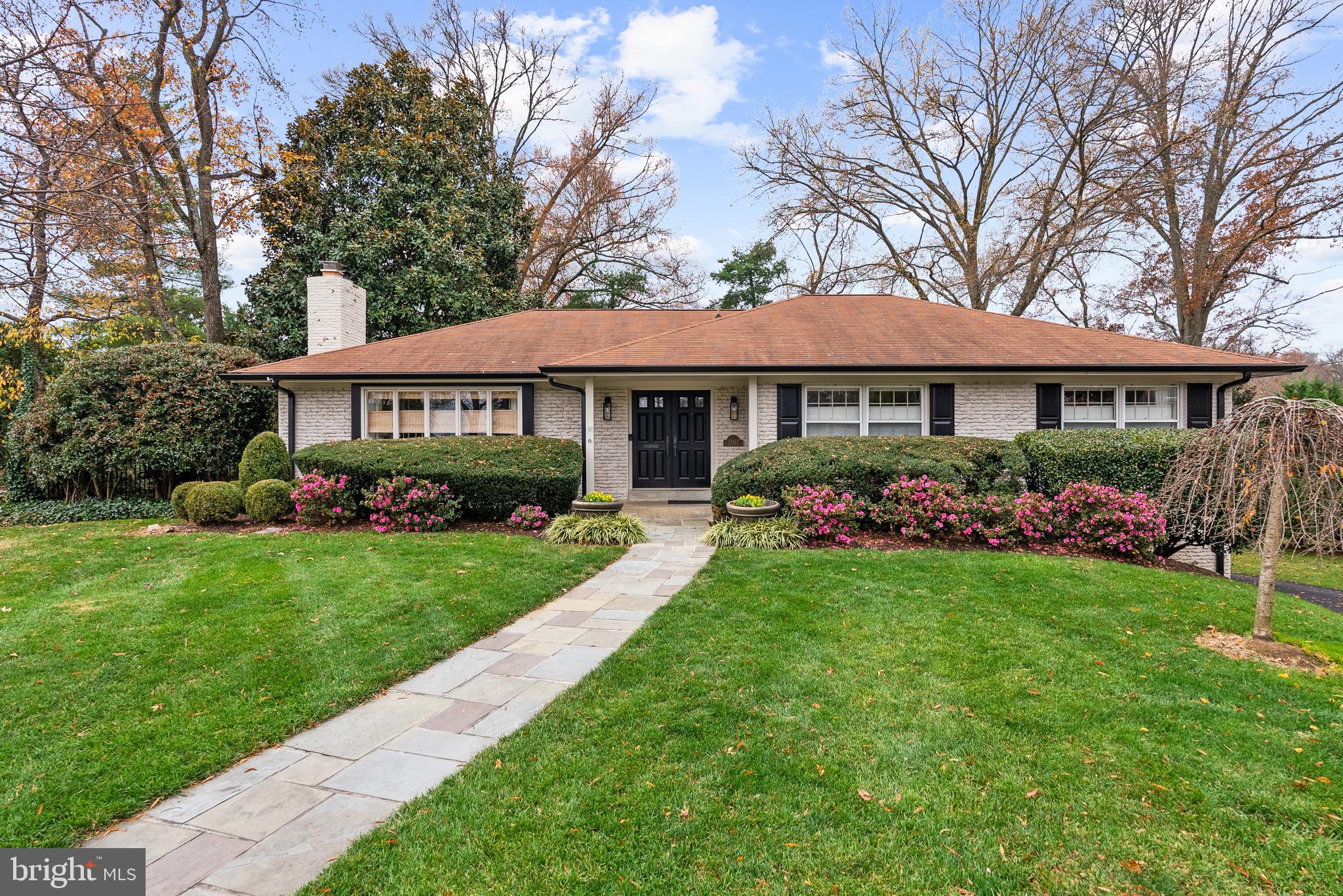 1101 Gatewood Drive Alexandria, VA 22307 - Photo 2 of 63 a front view of a house with a garden