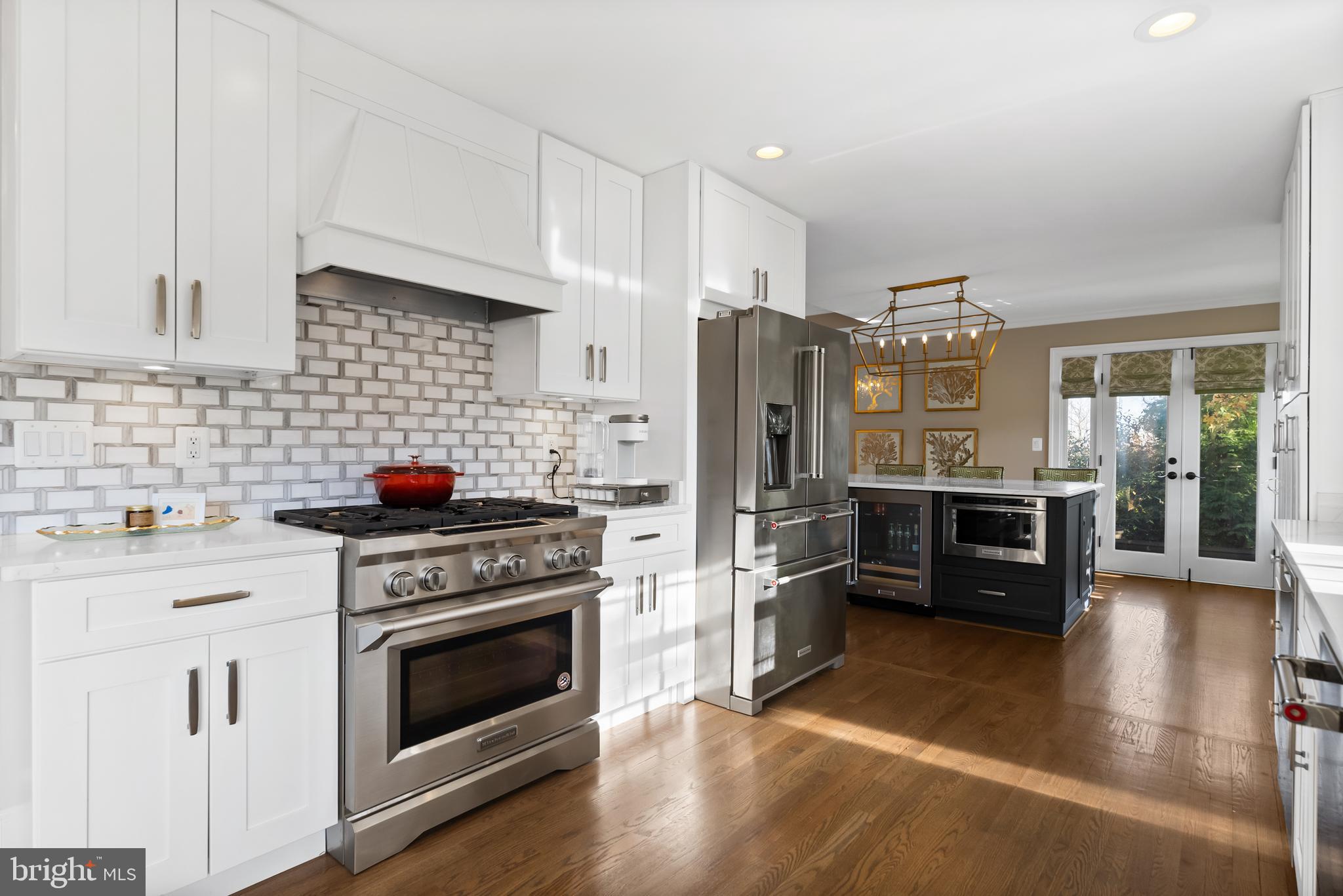 1101 Gatewood Drive Alexandria, VA 22307 - Photo 21 of 63 a kitchen with stainless steel appliances a stove a refrigerator and cabinets
