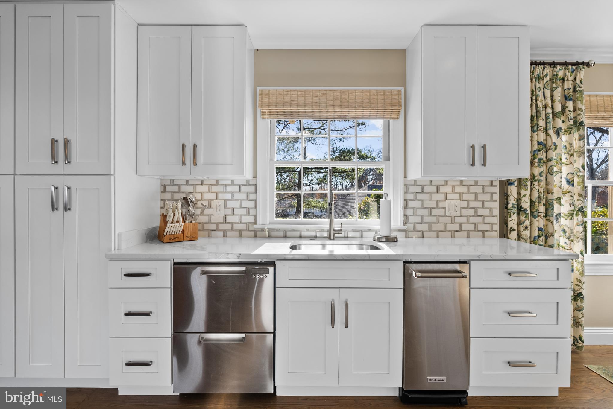 1101 Gatewood Drive Alexandria, VA 22307 - Photo 24 of 63 a kitchen with cabinets appliances a sink and a window
