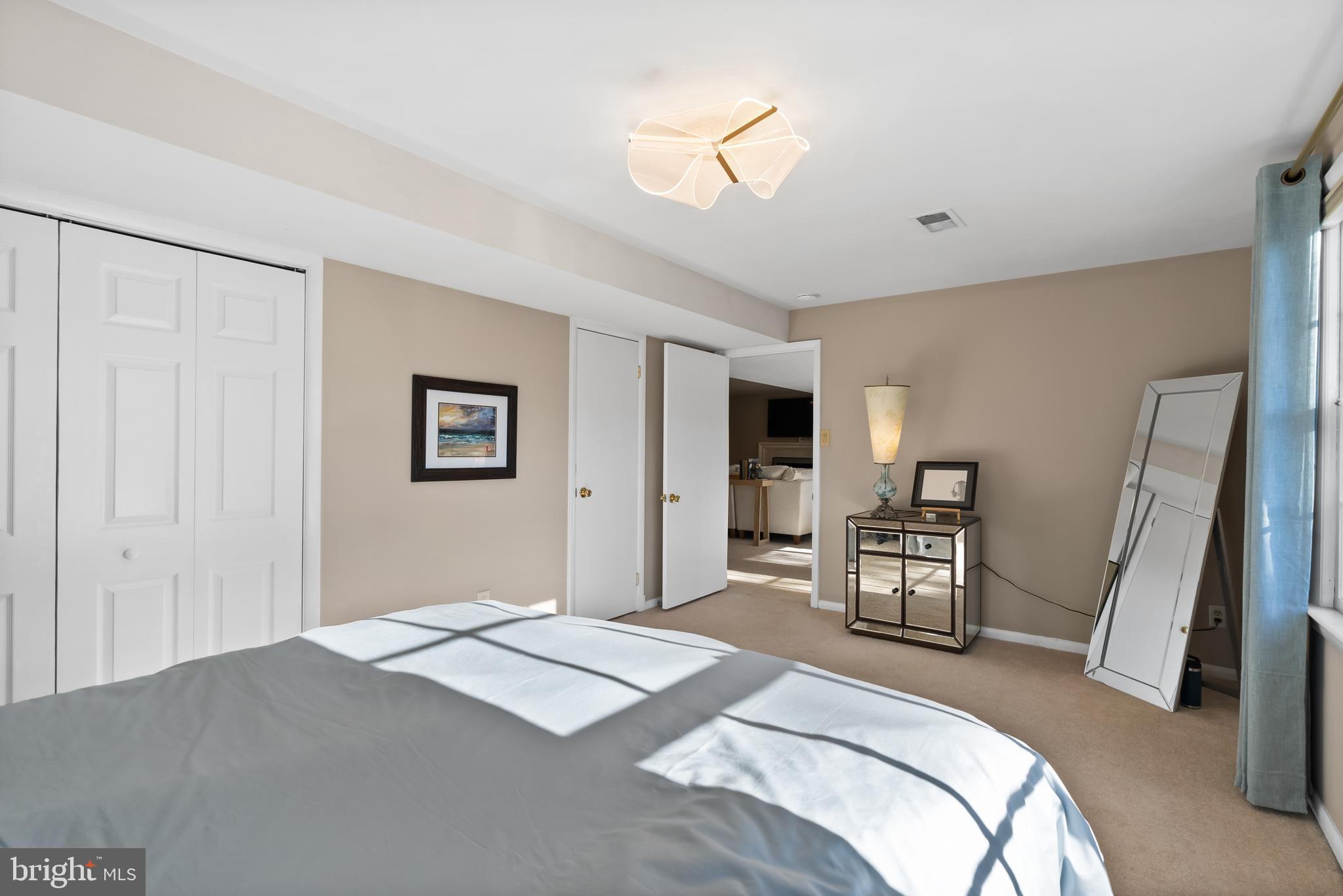 1101 Gatewood Drive Alexandria, VA 22307 - Photo 58 of 63 a bedroom with a bed and a flat screen tv