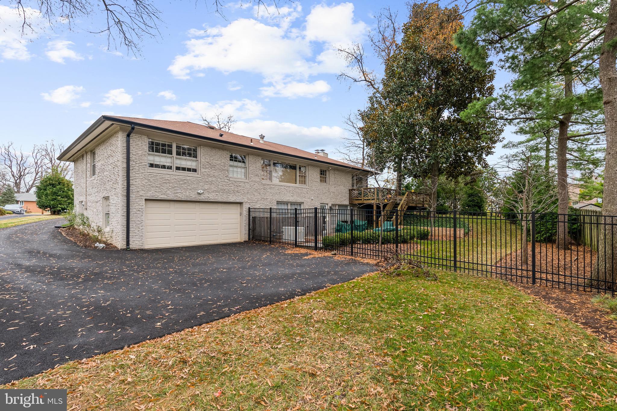 1101 Gatewood Drive Alexandria, VA 22307 - Photo 62 of 63 a view of an house with backyard space and a tree