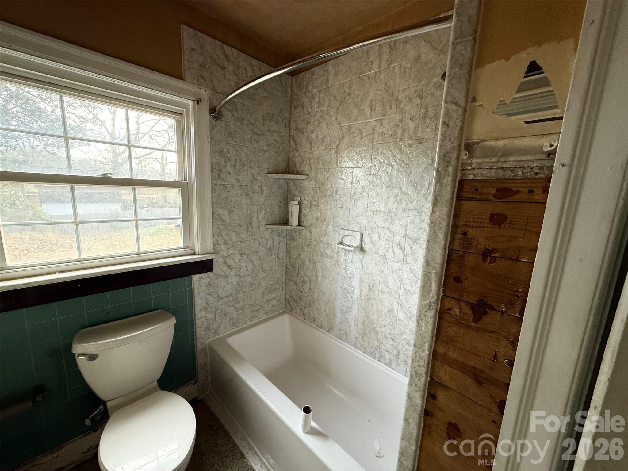 104 Brookhill Road Shelby, NC 28150 - Photo 17 of 40 a bathroom with a toilet and a shower