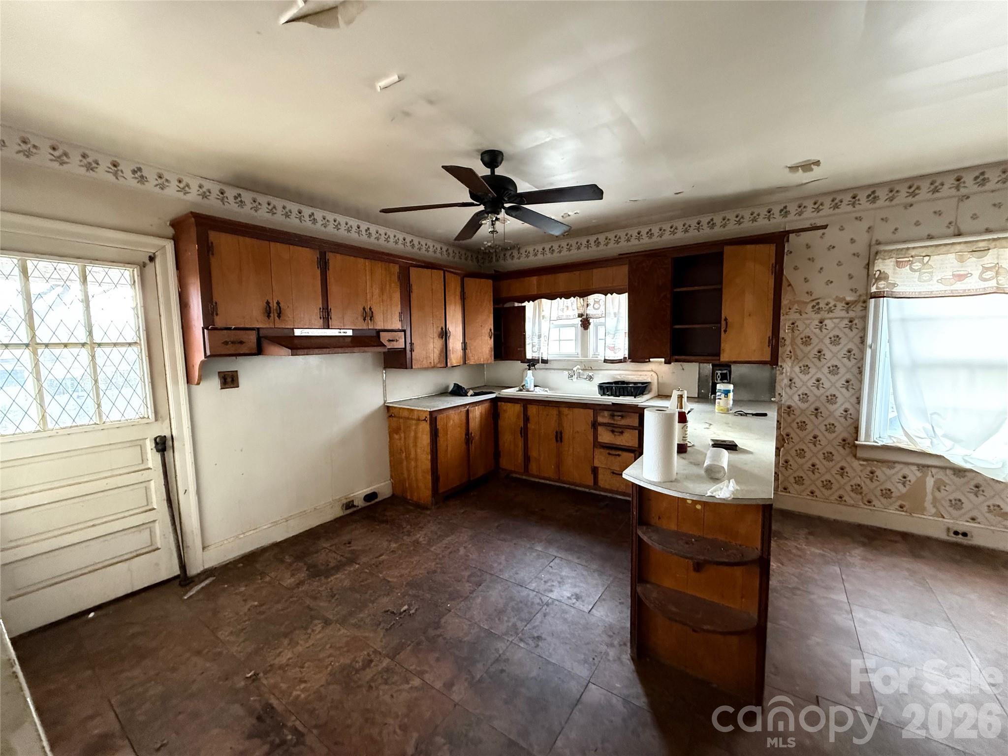 104 Brookhill Road Shelby, NC 28150 - Photo 19 of 40 a kitchen with granite countertop a sink stainless steel appliances and cabinets