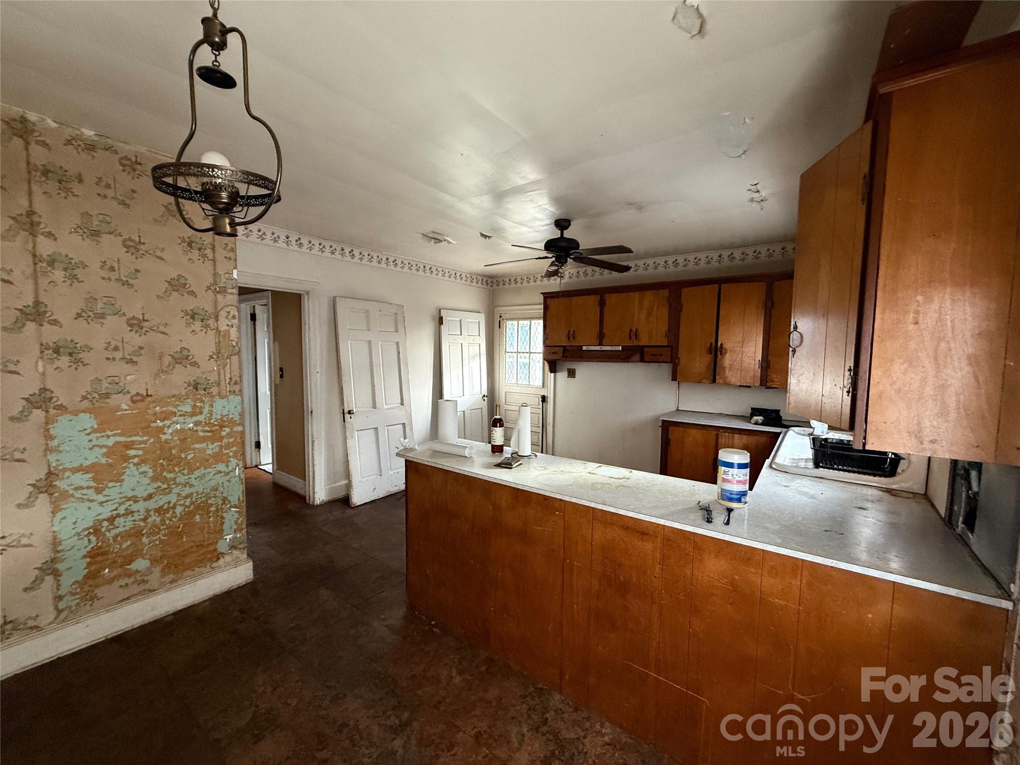 104 Brookhill Road Shelby, NC 28150 - Photo 21 of 40 a view of a room with kitchen island stainless steel appliances sink and living room view