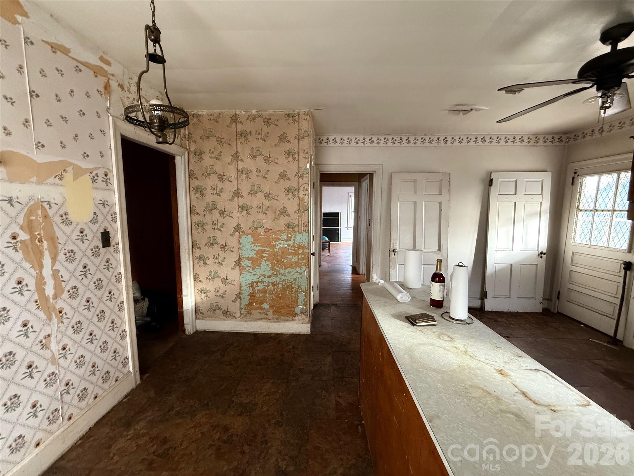 104 Brookhill Road Shelby, NC 28150 - Photo 22 of 40 a living room with a couch and a chandelier