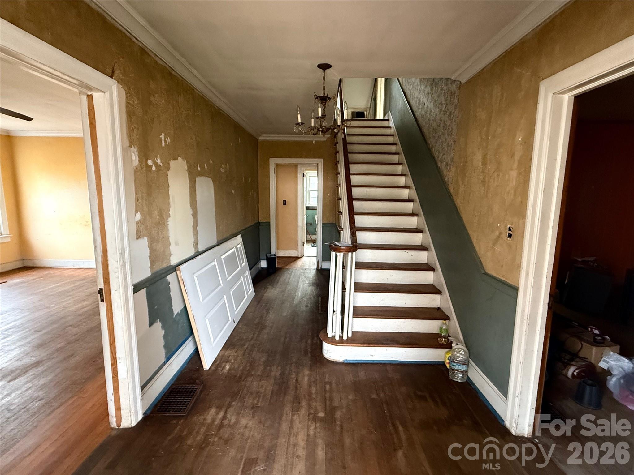 104 Brookhill Road Shelby, NC 28150 - Photo 8 of 40 a view of a hallway with wooden floor and stairs
