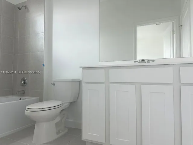 a bathroom with a toilet and a sink