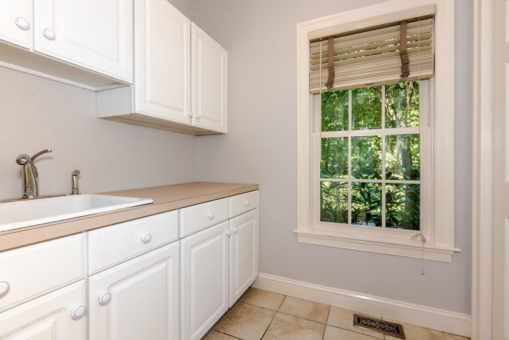 38 Bowditch Road Sudbury, MA 01776 - Photo 15 of 42 a room with a sink and cabinets